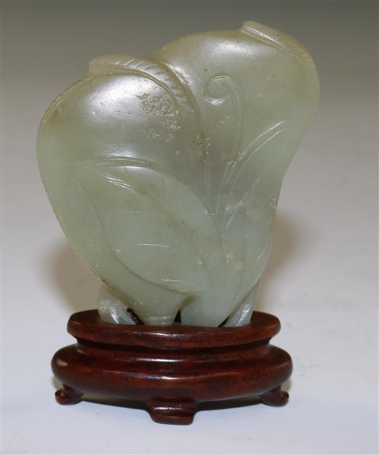 A Chinese celadon jade carving of gourds, 18th/19th century, 6cm, wood stand